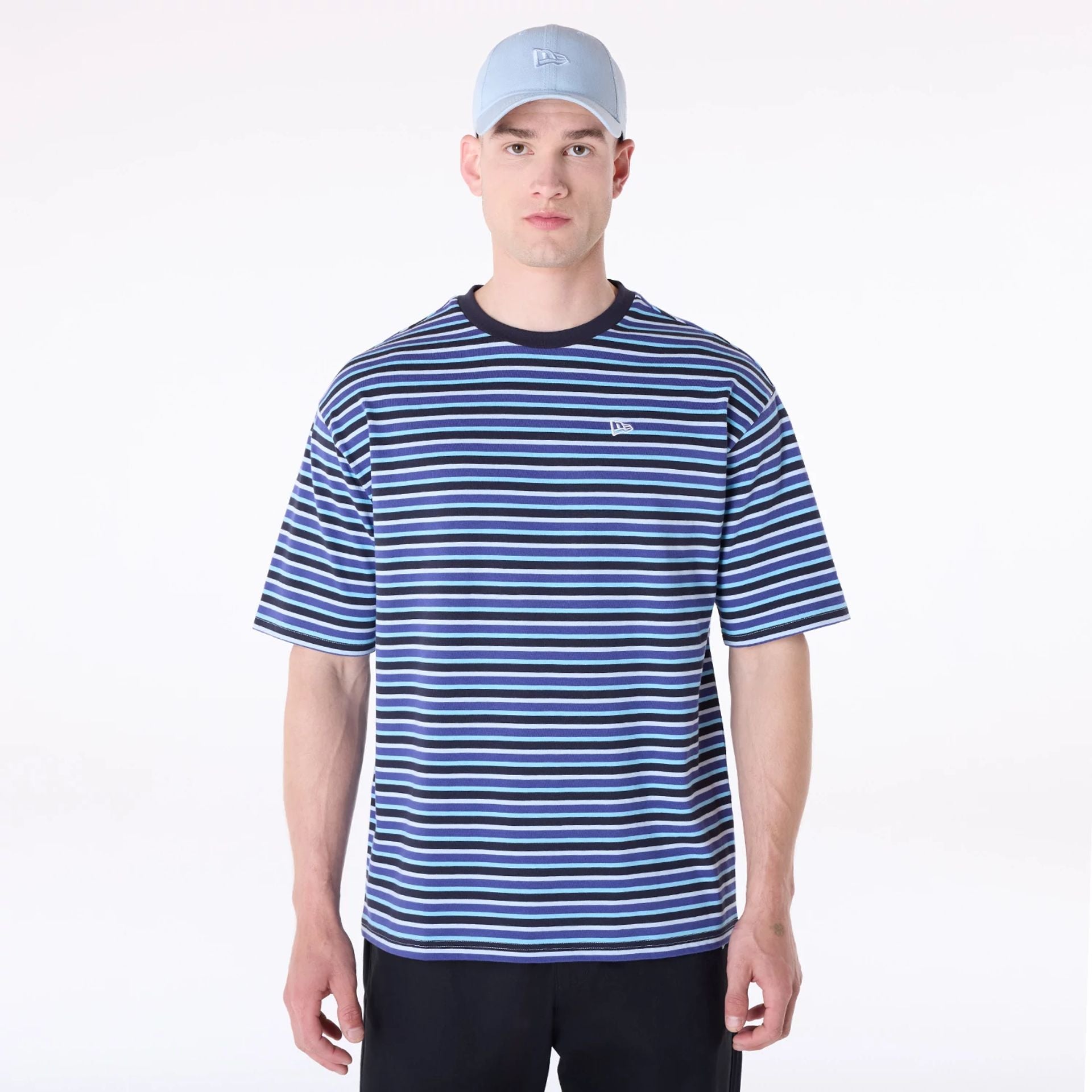 The Male model is wearing New Era Stripe Pastel Blue T-Shirt 1