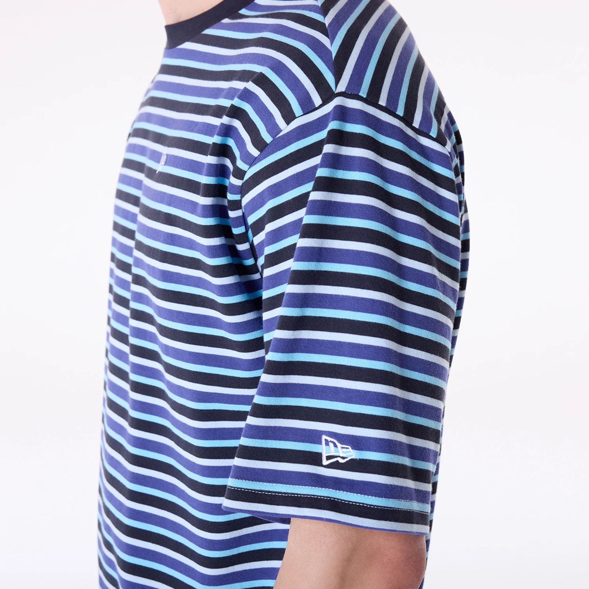 The Male model is wearing New Era Stripe Pastel Blue T-Shirt 4