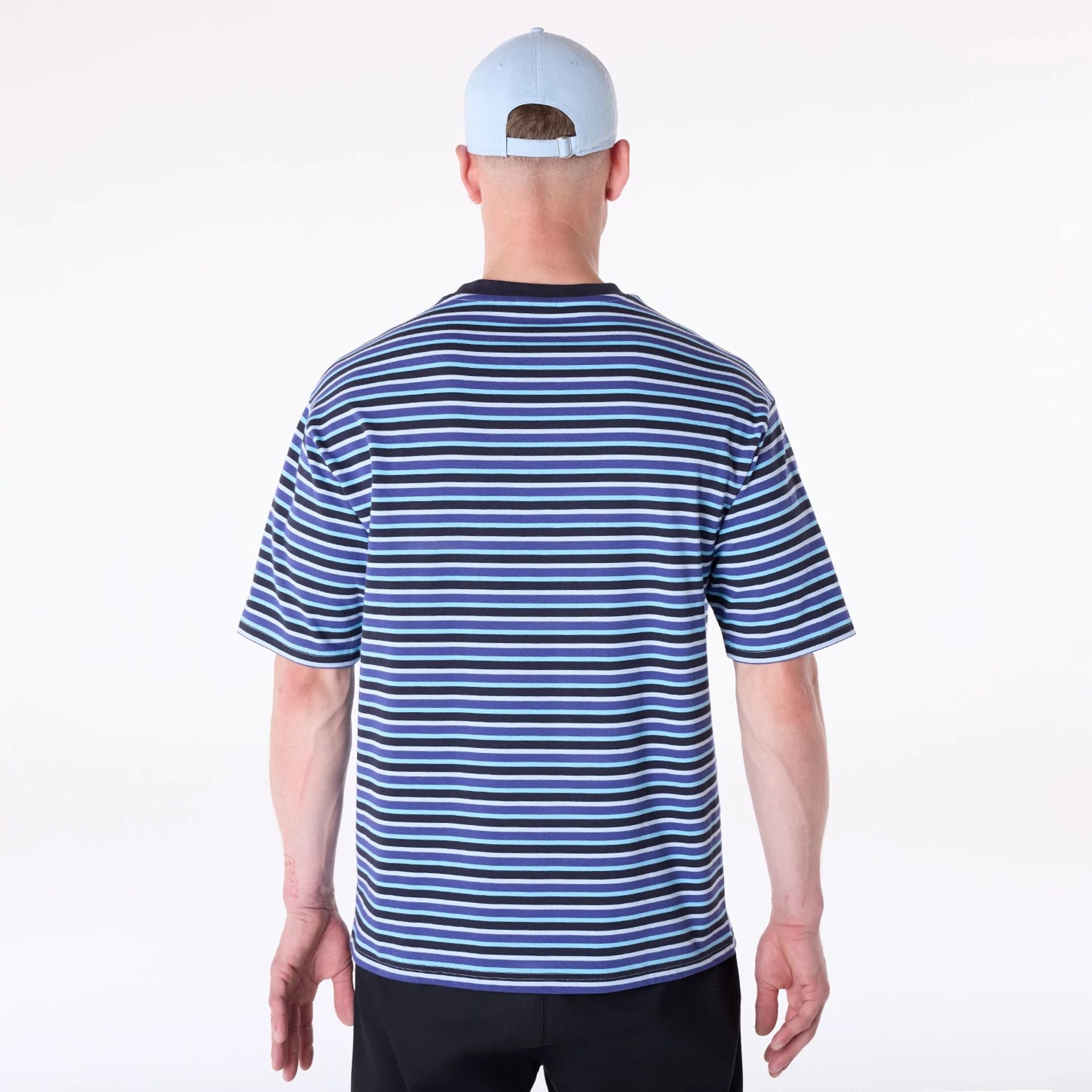 The Male model is wearing New Era Stripe Pastel Blue T-Shirt 2