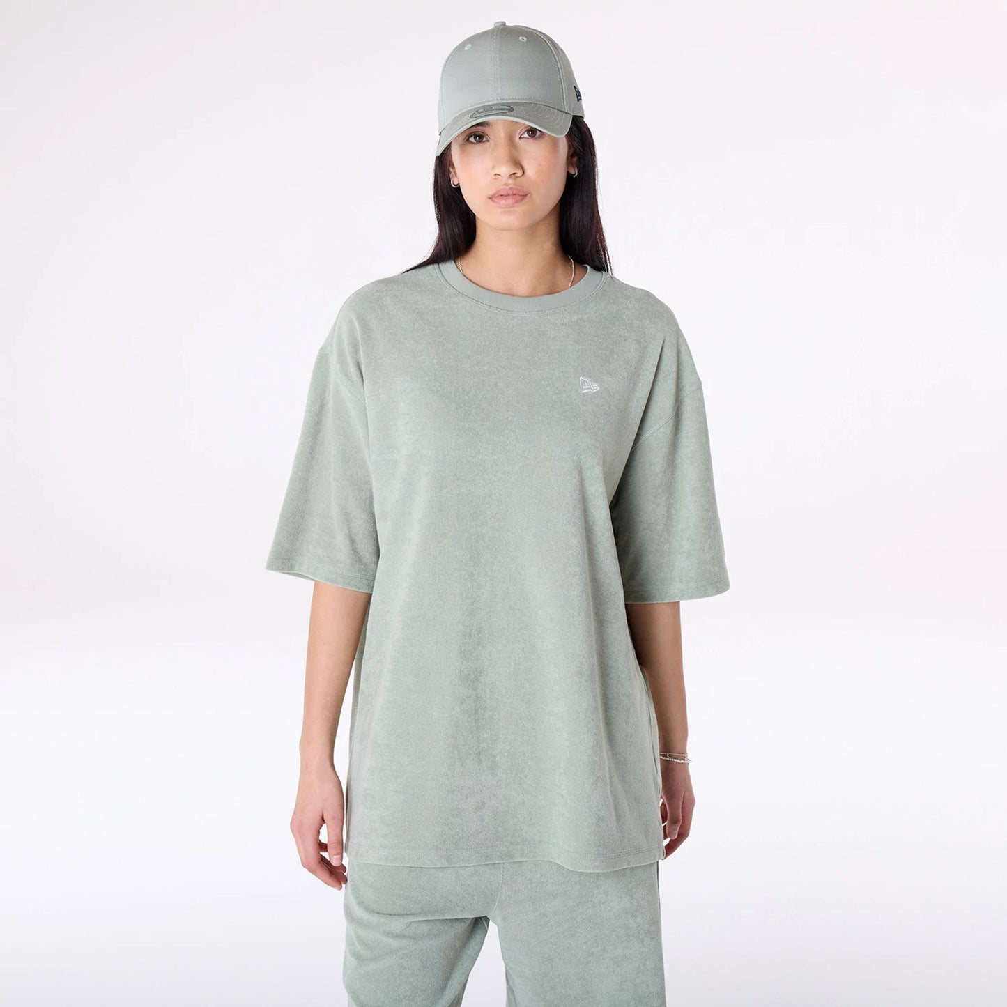 The Male model is wearing New Era Towelling Pastel Green Oversized T-Shirt 3