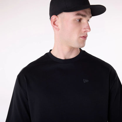 The Male model is wearing New Era Sticker Black Oversized T-Shirt 7