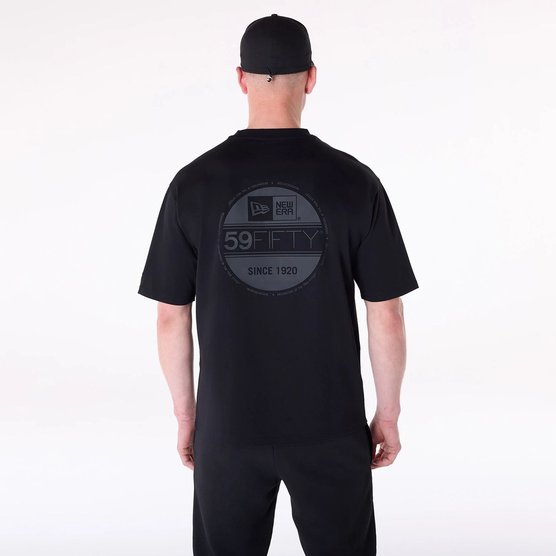 The Male model is wearing New Era Sticker Black Oversized T-Shirt 2