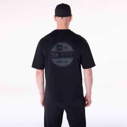 The Male model is wearing New Era Sticker Black Oversized T-Shirt 2