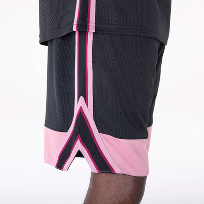 The Male model is wearing New Era Mesh Black Oversized Shorts 5