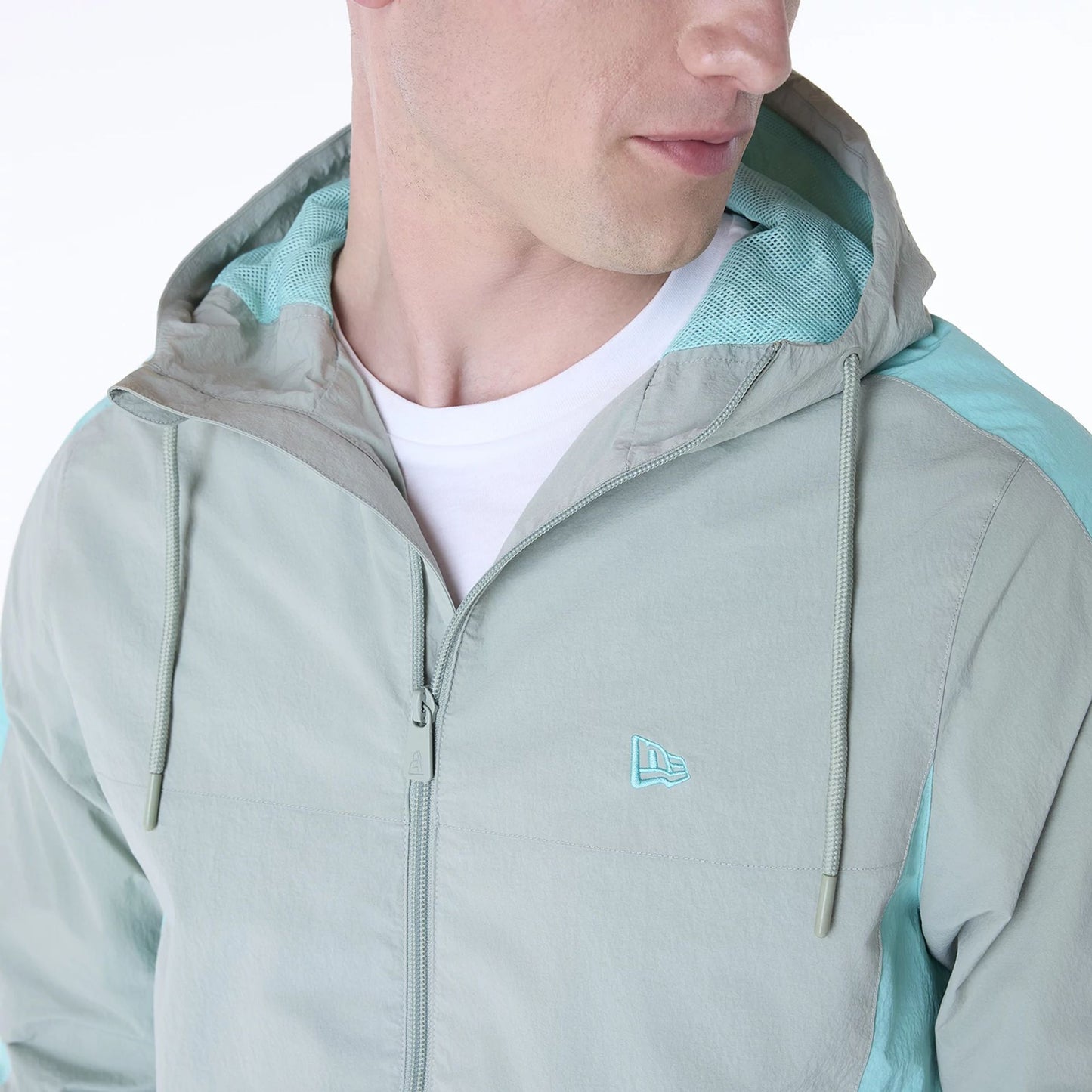 The Male model is wearing New Era Colour Block Pastel Green Jacket 5