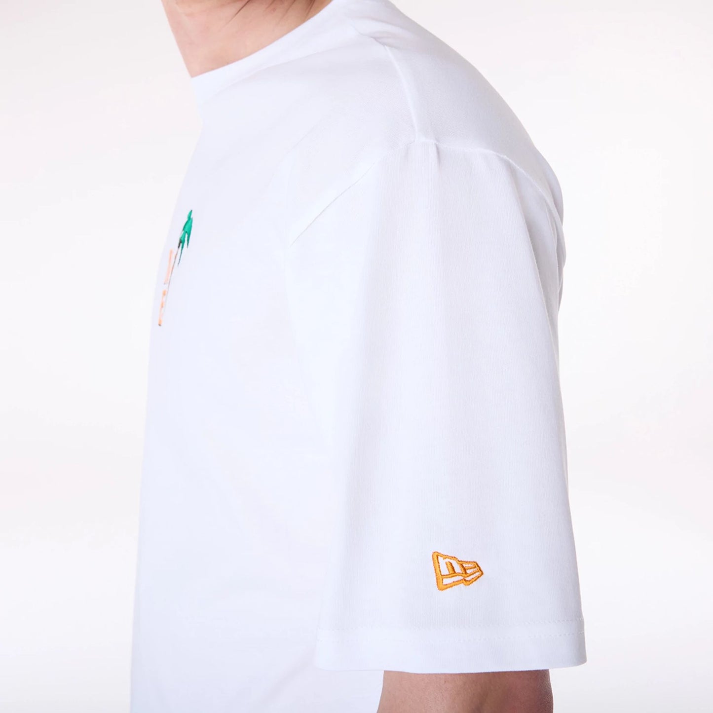 The Male model is wearing New Era Drink Graphic White Oversized T-Shirt 7