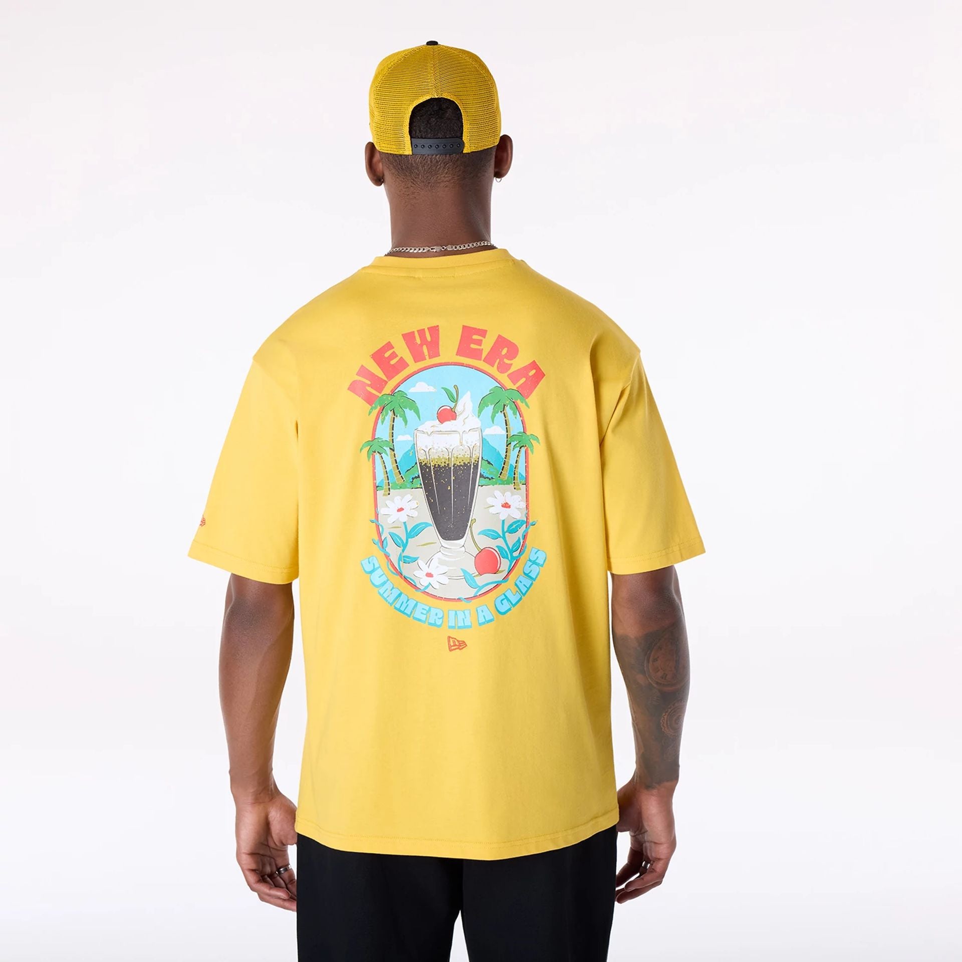 The Male model is wearing New Era Drink Graphic Yellow Oversized T-Shirt 2