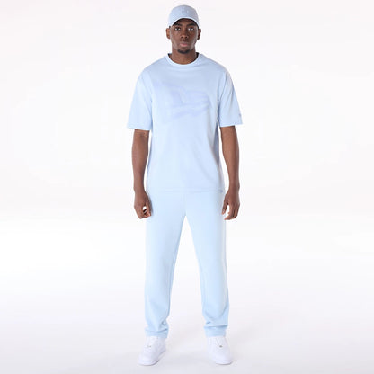 The Male model is wearing New Era Flag Pastel Blue Oversized T-Shirt 5