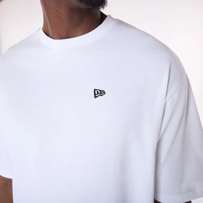 The Male model is wearing New Era Baseball Graphic White Oversized T-Shirt 4