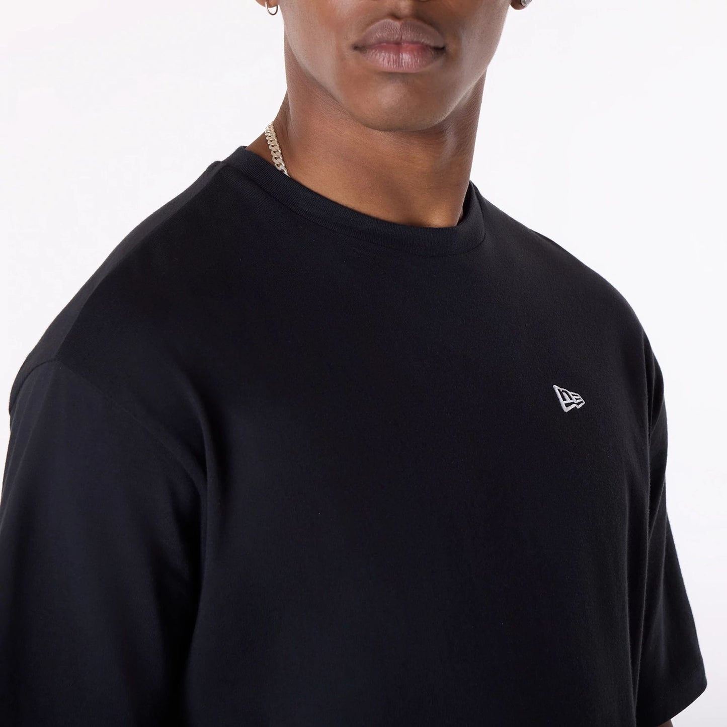 The Male model is wearing New Era Baseball Graphic Black Oversized T-Shirt 7