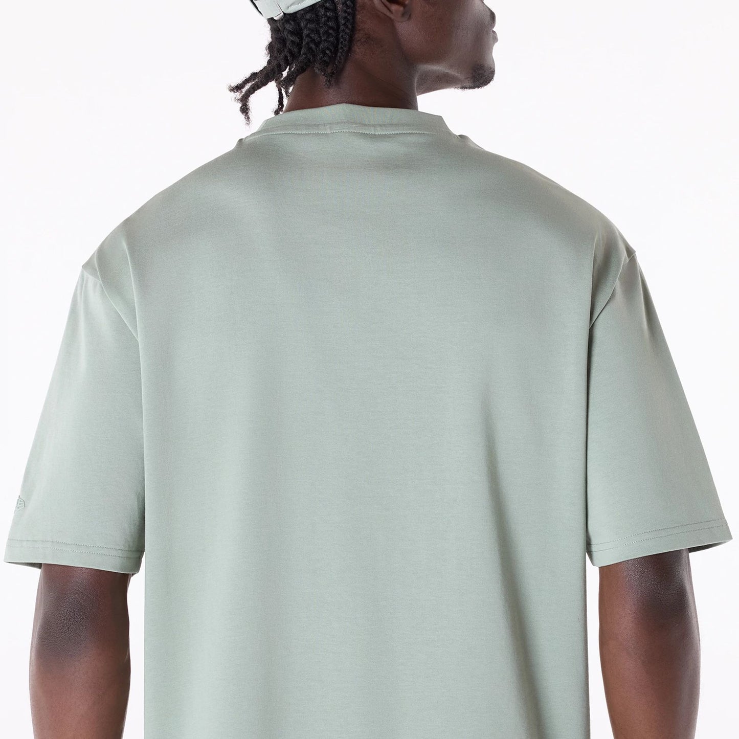 The Male model is wearing New Era Flag Pastel Green Oversized T-Shirt 5