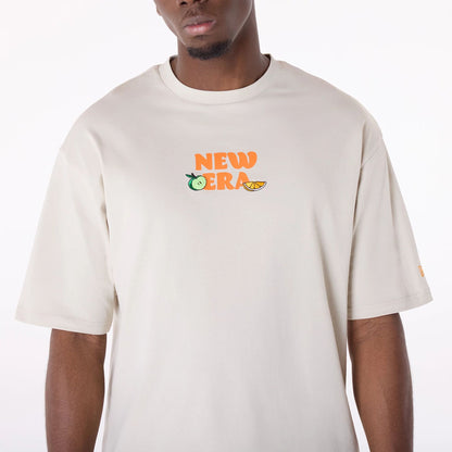 The Male model is wearing New Era Drink Graphic Cream Oversized T-Shirt 3