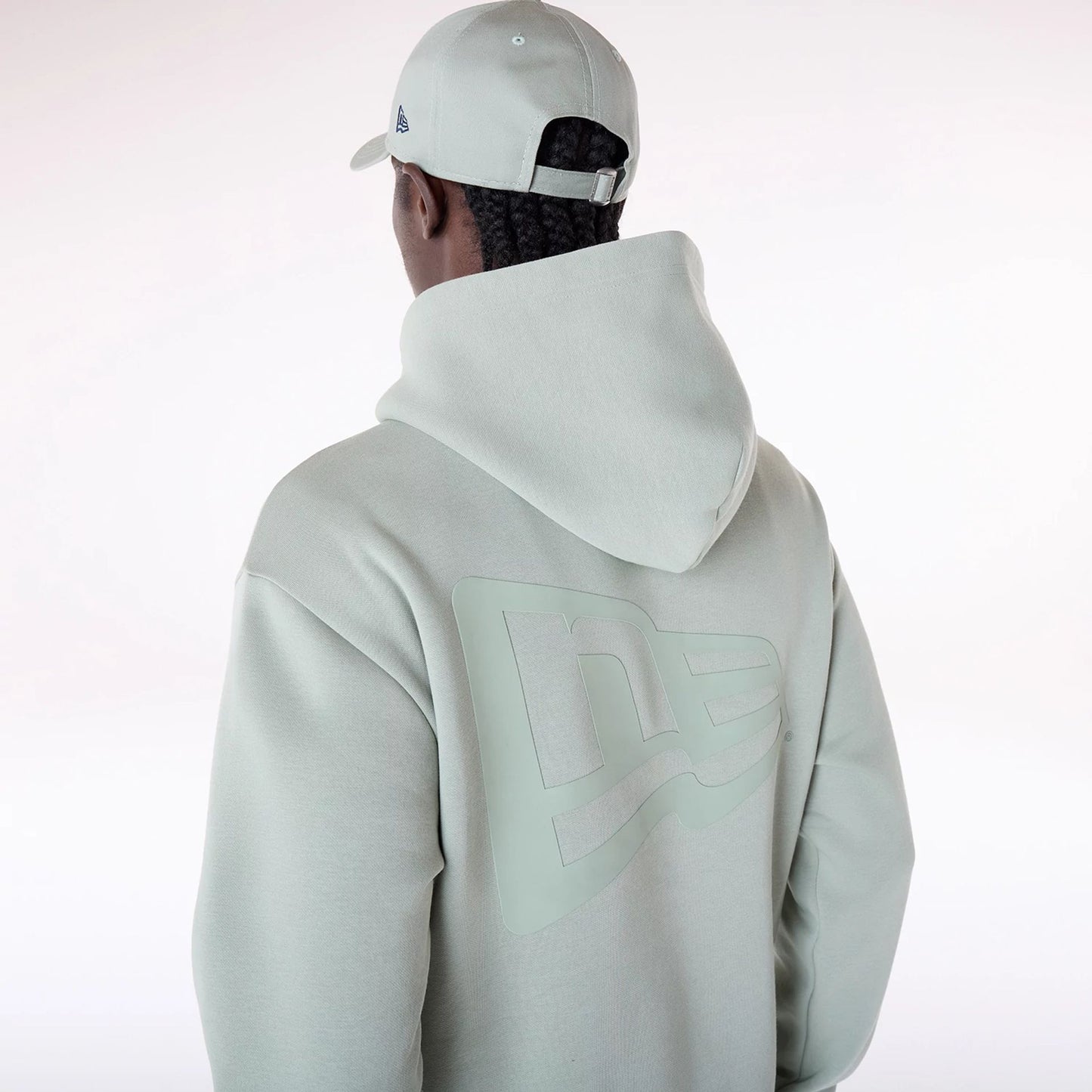 The Male model is wearing New Era Flag Pastel Green Oversized Pullover Hoodie 7