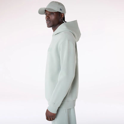 The Male model is wearing New Era Flag Pastel Green Oversized Pullover Hoodie 6