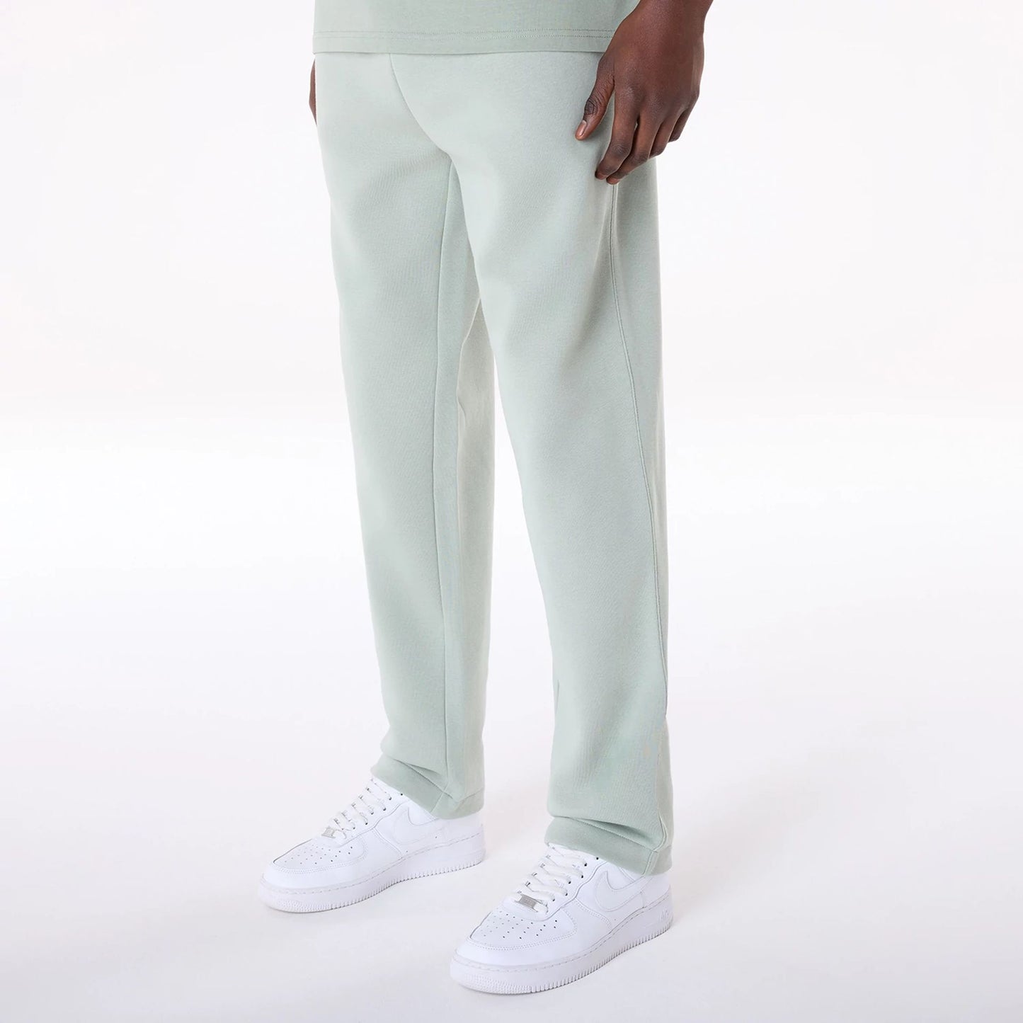 The Male model is wearing New Era Straight Leg Pastel Green Joggers 7