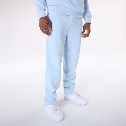 The Male model is wearing New Era Straight Leg Pastel Blue Joggers 4