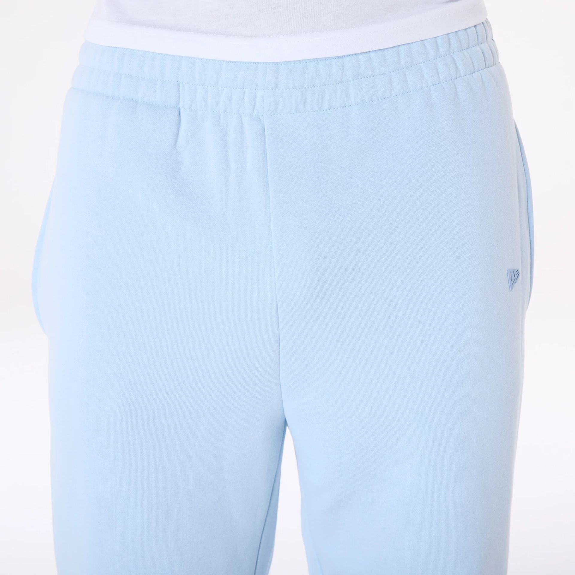 The Male model is wearing New Era Straight Leg Pastel Blue Joggers 5