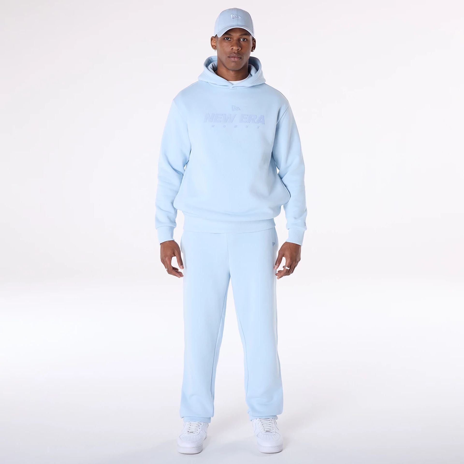 The Male model is wearing New Era Straight Leg Pastel Blue Joggers 6