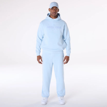 The Male model is wearing New Era Straight Leg Pastel Blue Joggers 6