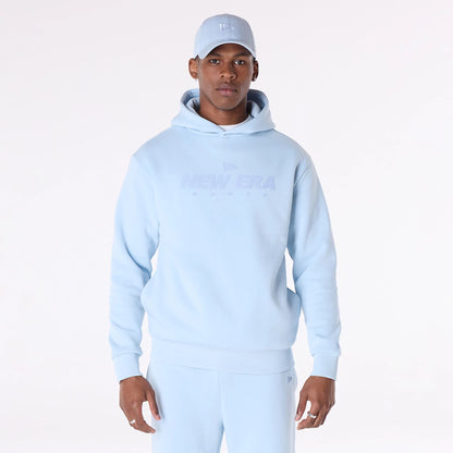 The Male model is wearing New Era Flag Pastel Blue Oversized Pullover Hoodie 4