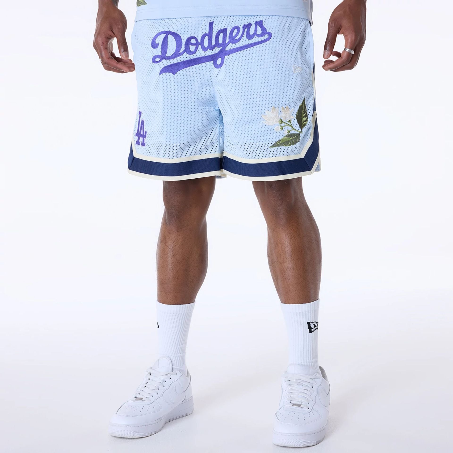 The Male model is wearing LA Dodgers MLB Floral Pastel Blue Shorts 1