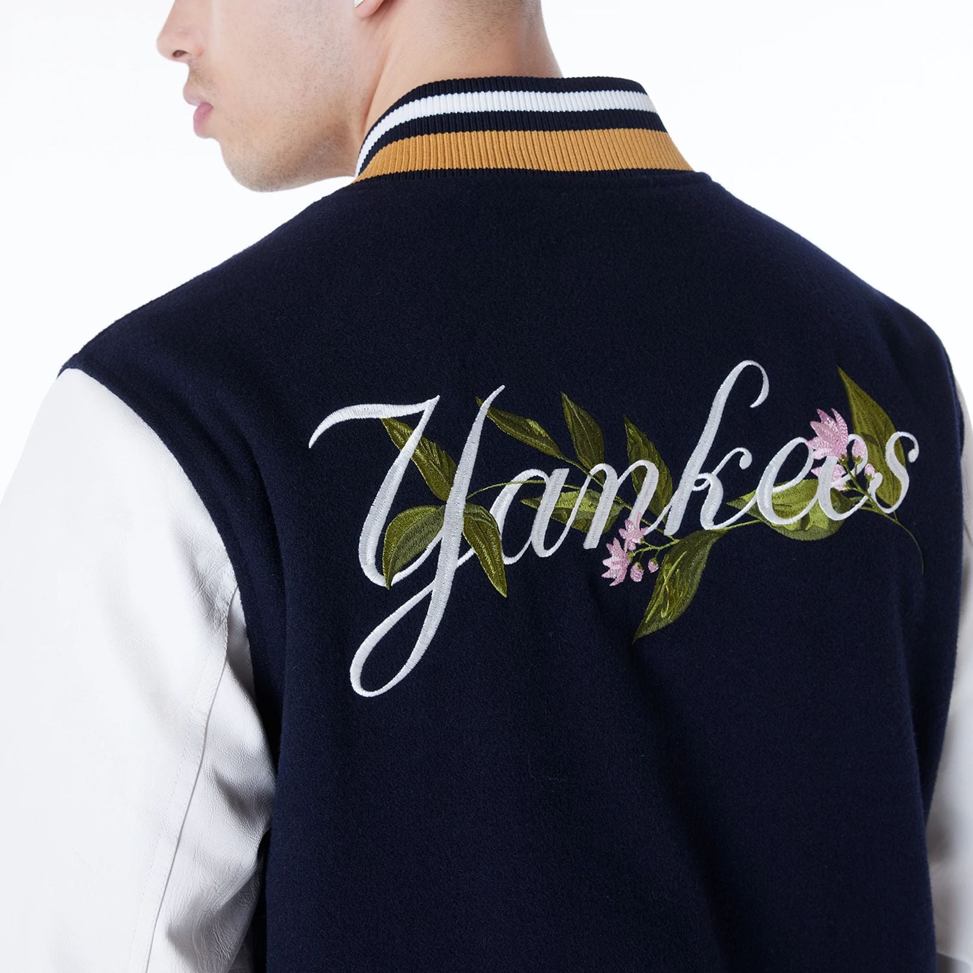 The Male model is wearing New York Yankees MLB Floral Navy Jacket 4