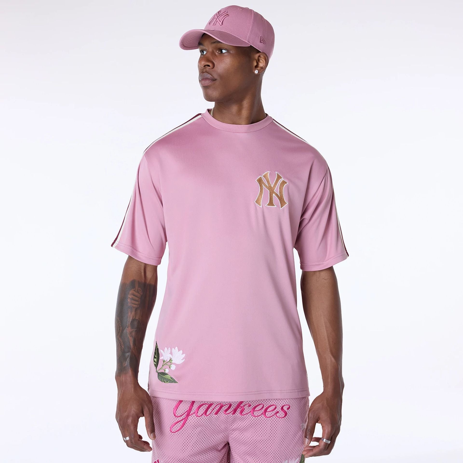 The Male model is wearing New York Yankees MLB Floral Dark Pink Oversized T-Shirt 1