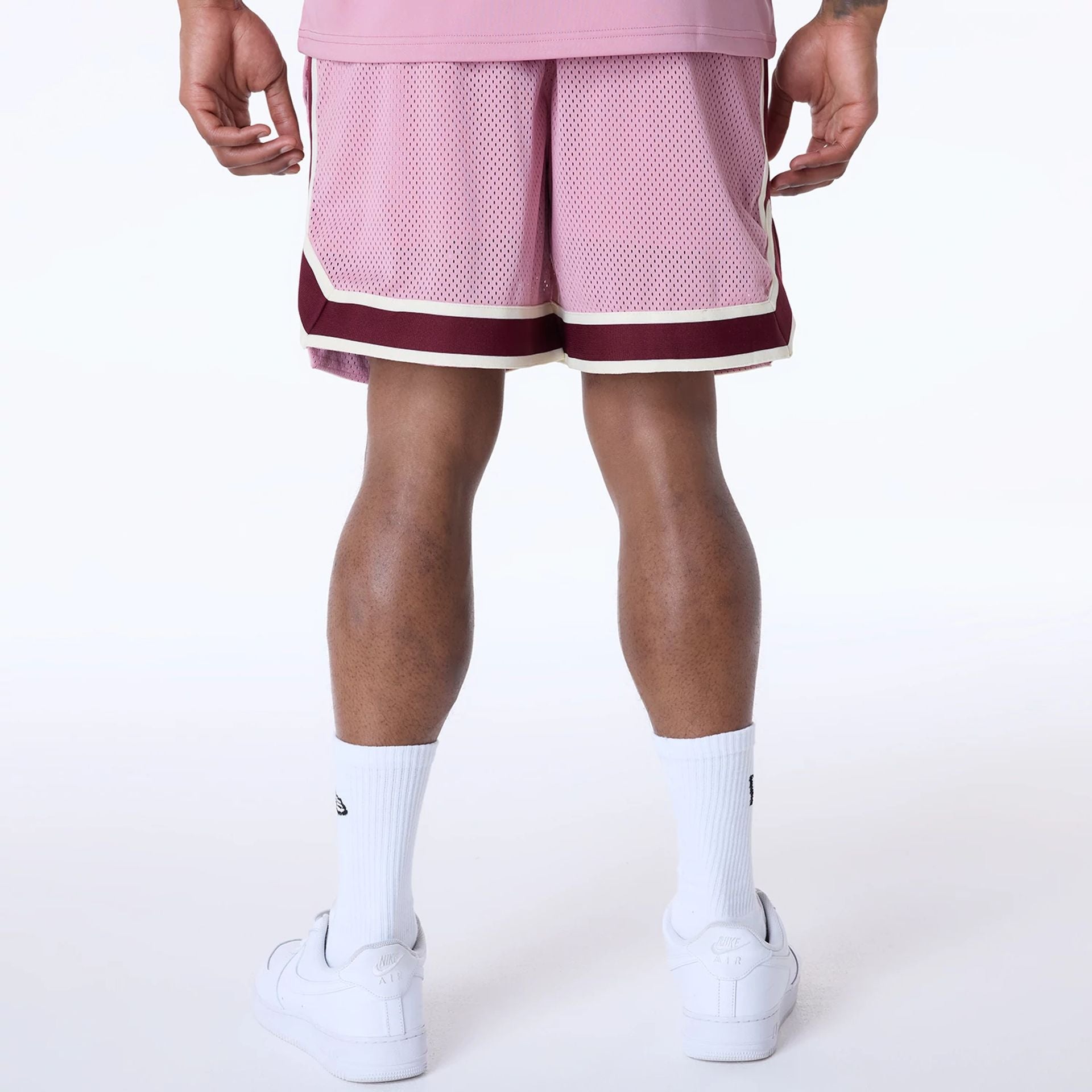 The Male model is wearing New York Yankees MLB Floral Dark Pink Shorts 2