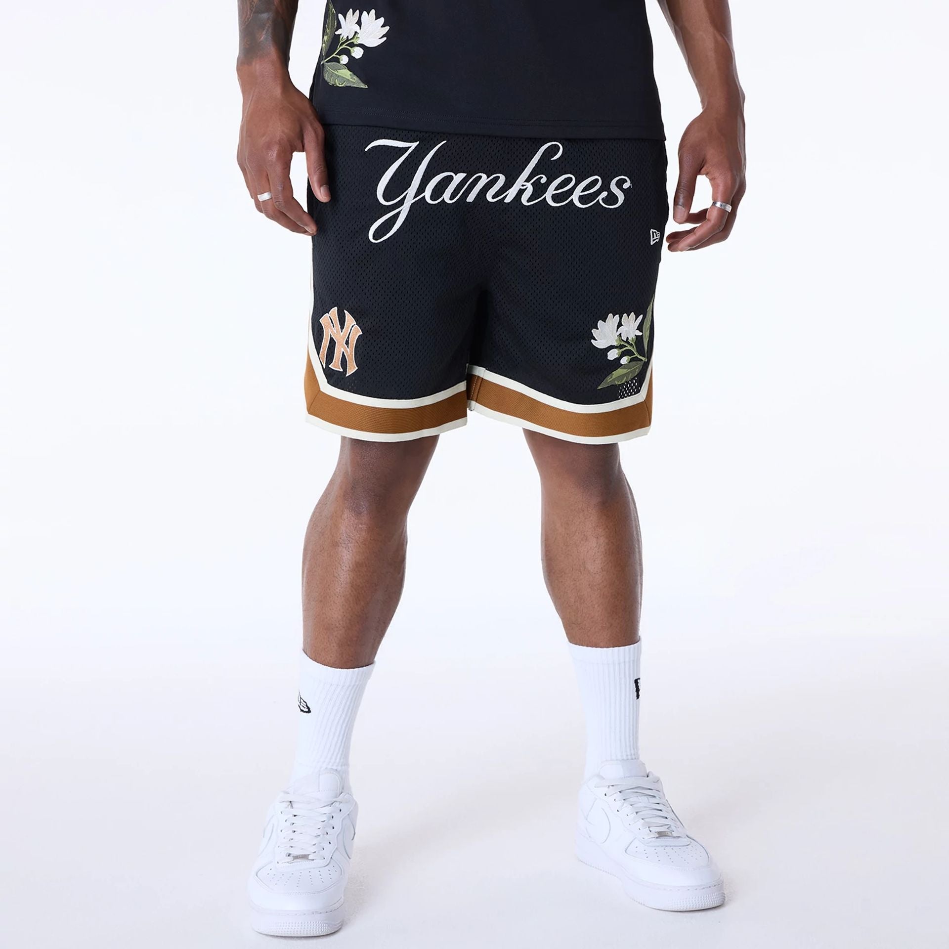 The Male model is wearing New York Yankees MLB Floral Black Shorts 1