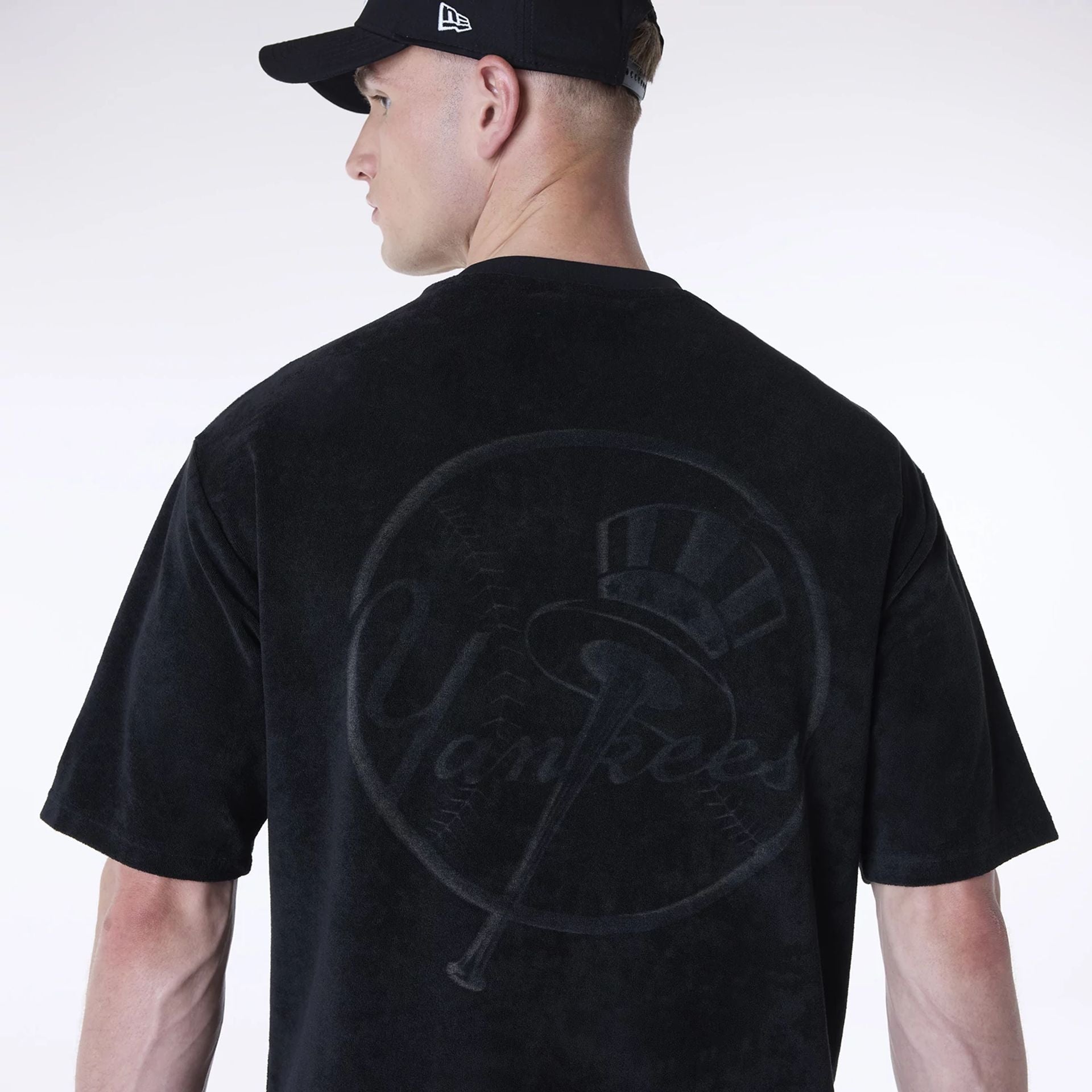 The Male model is wearing New York Yankees MLB Towelling Black Oversized T-Shirt 4