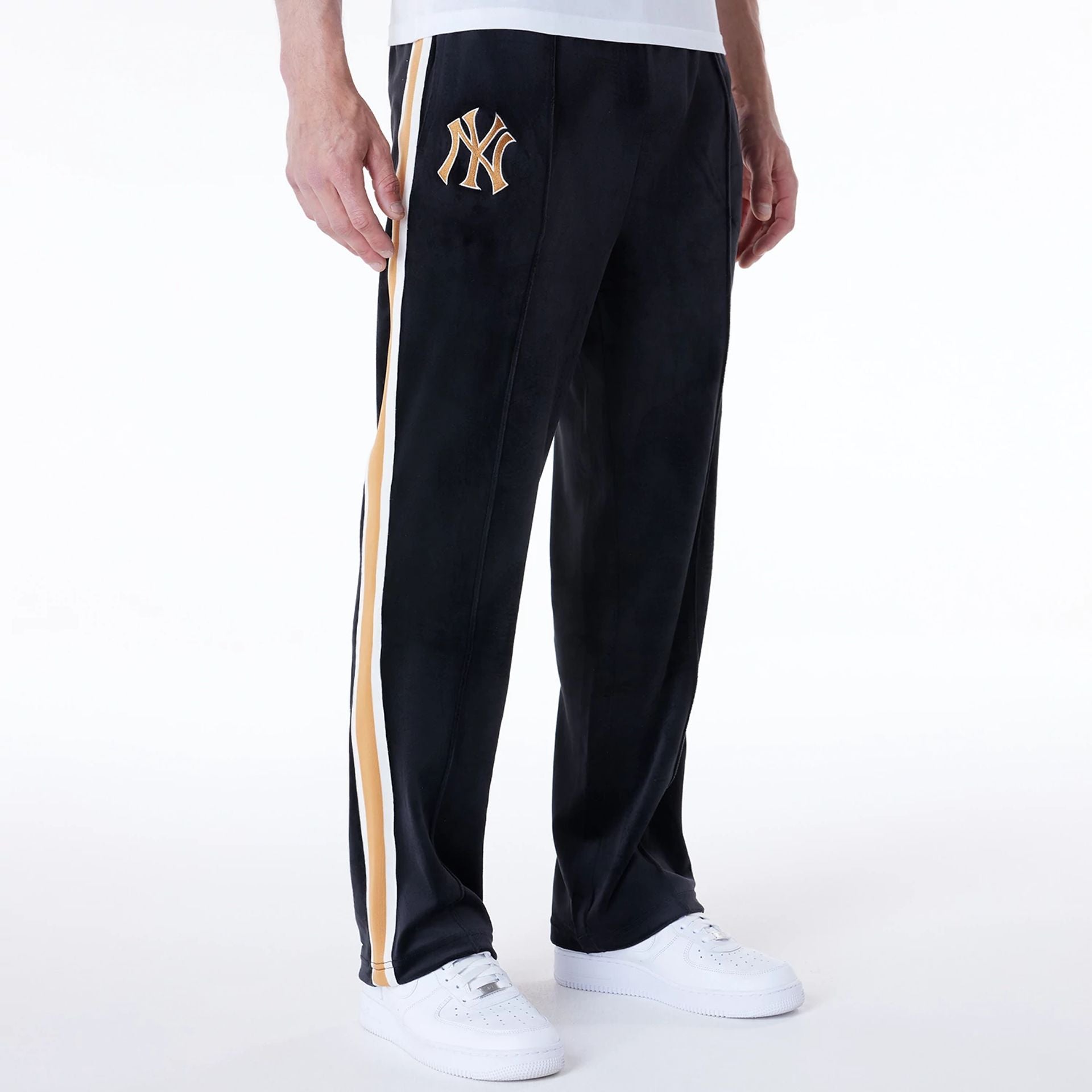 The Male model is wearing New York Yankees MLB Velour Black Joggers 1