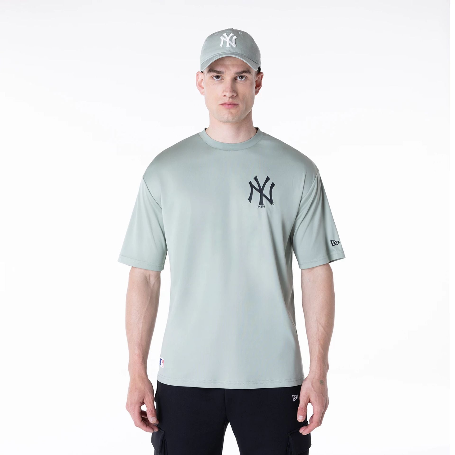 The Male model is wearing New York Yankees League Essential Pastel Green T-Shirt 1