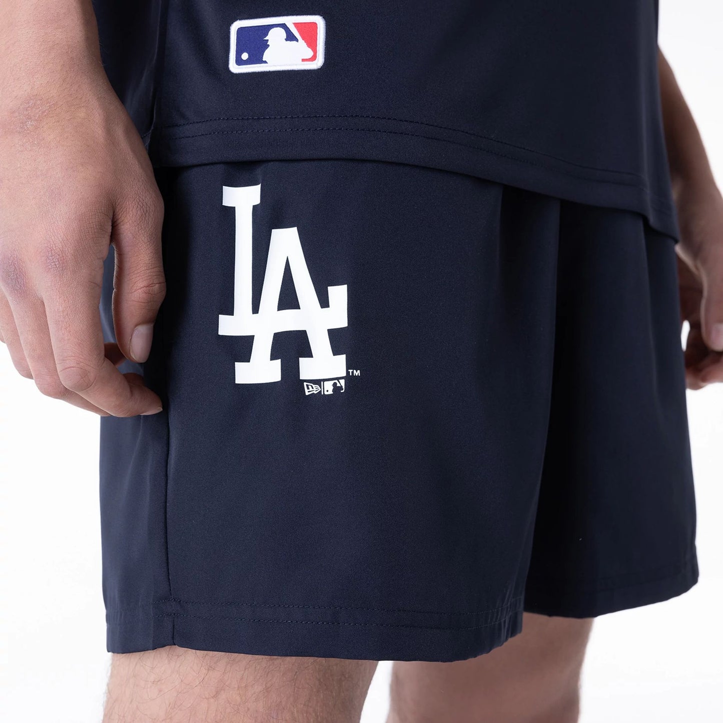 The Male model is wearing LA Dodgers League Essential Navy Shorts 7