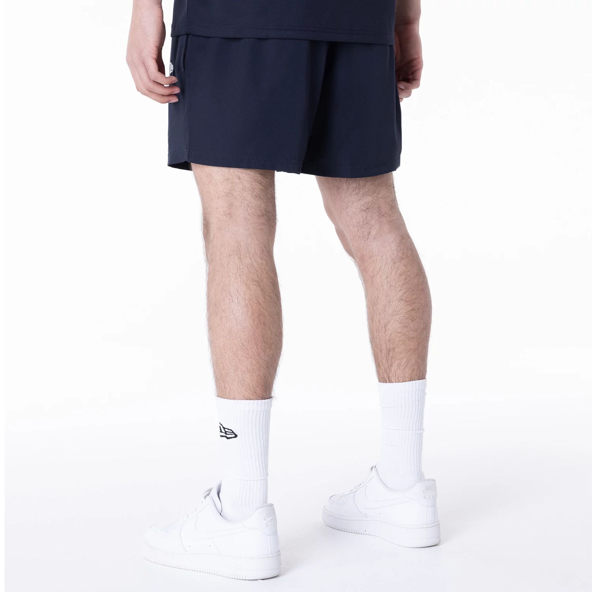 The Male model is wearing LA Dodgers League Essential Navy Shorts 4