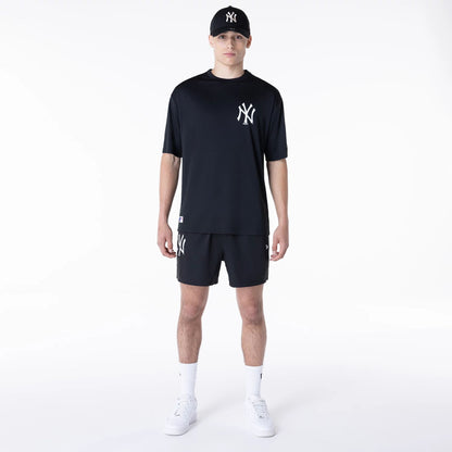 The Male model is wearing New York Yankees League Essential Black Shorts 4