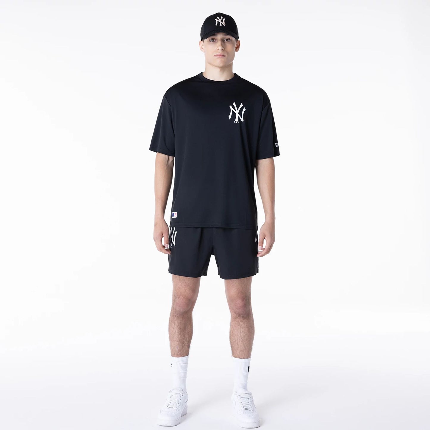 The Male model is wearing New York Yankees League Essential Black T-Shirt 5