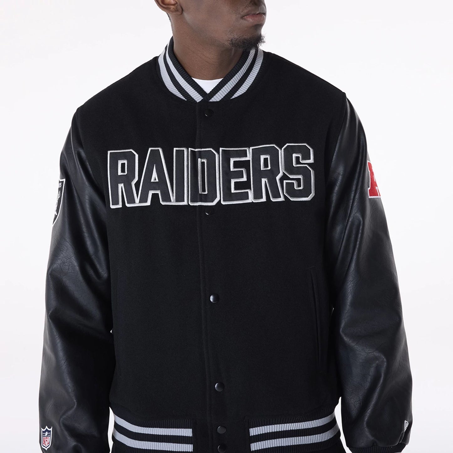 The Male model is wearing Las Vegas Raiders NFL Black Varsity Jacket 4