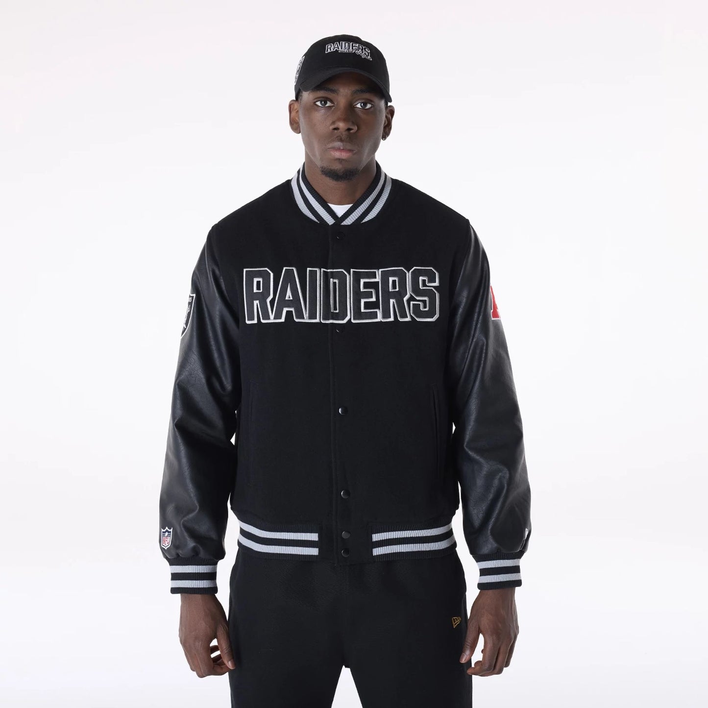 The Male model is wearing Las Vegas Raiders NFL Black Varsity Jacket 1