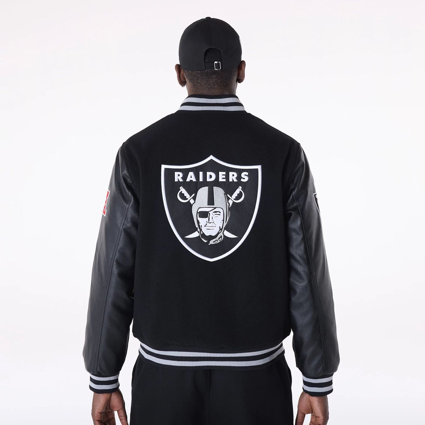 The Male model is wearing Las Vegas Raiders NFL Black Varsity Jacket 2