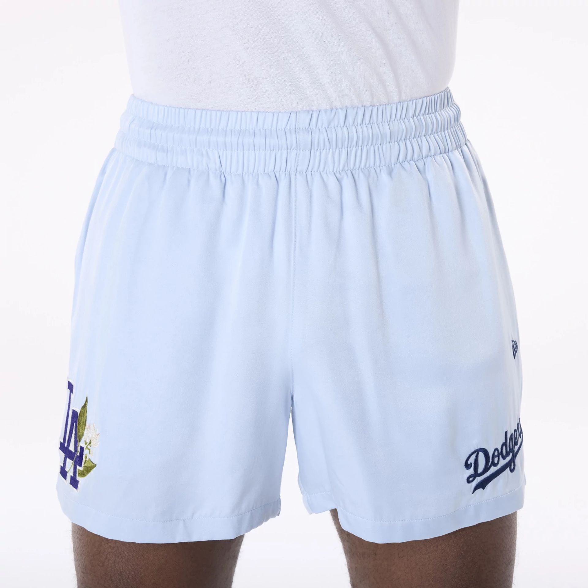 The Male model is wearing LA Dodgers MLB Woven Pastel Blue Shorts 3