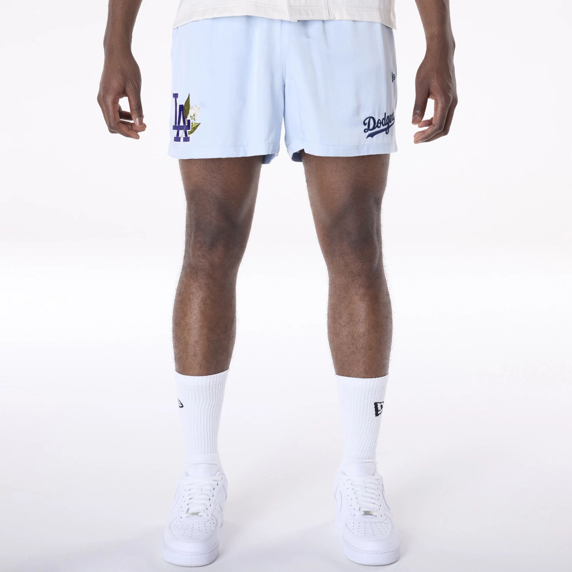 The Male model is wearing LA Dodgers MLB Woven Pastel Blue Shorts 1