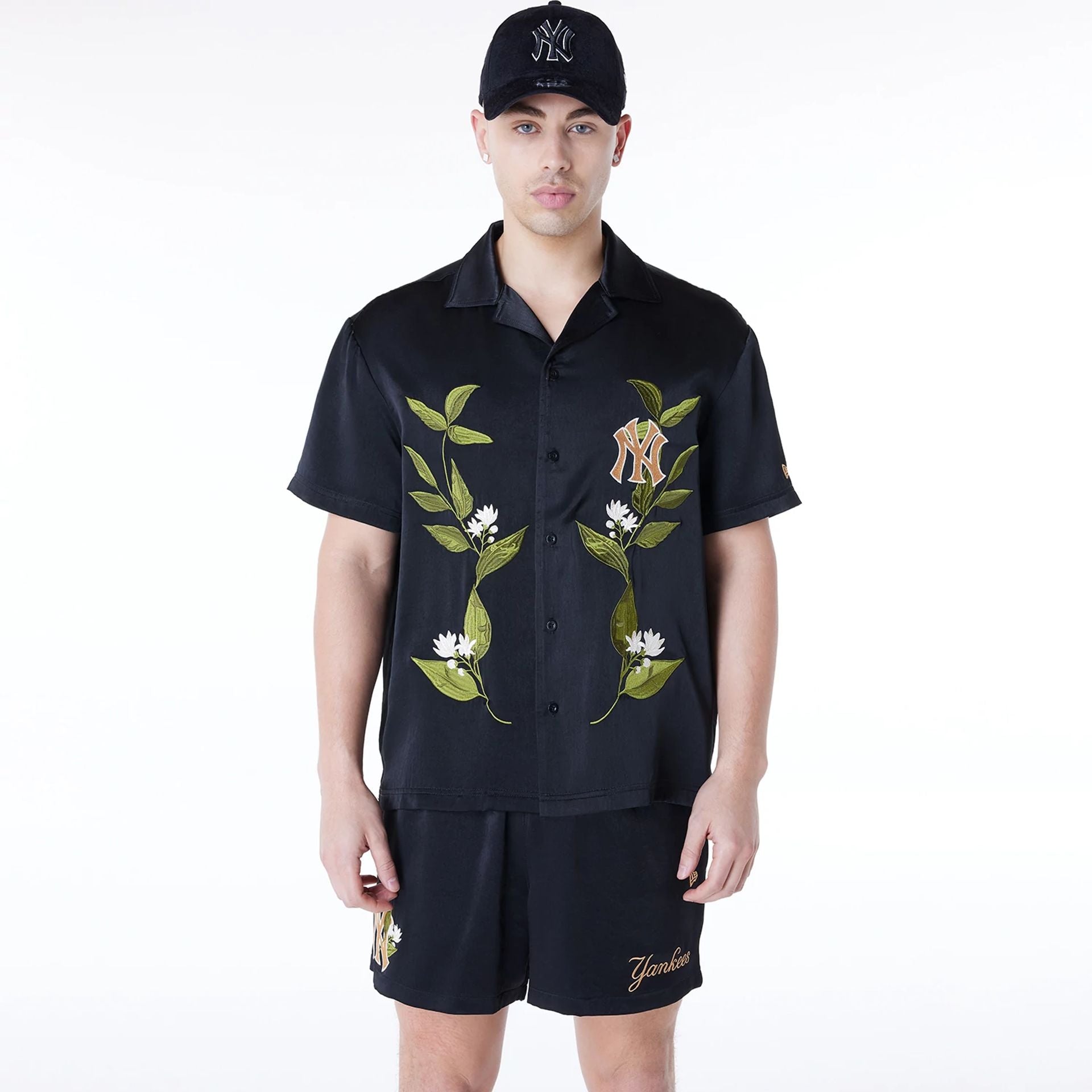 The Male model is wearing New York Yankees Floral Revere Black Short Sleeve Shirt 1