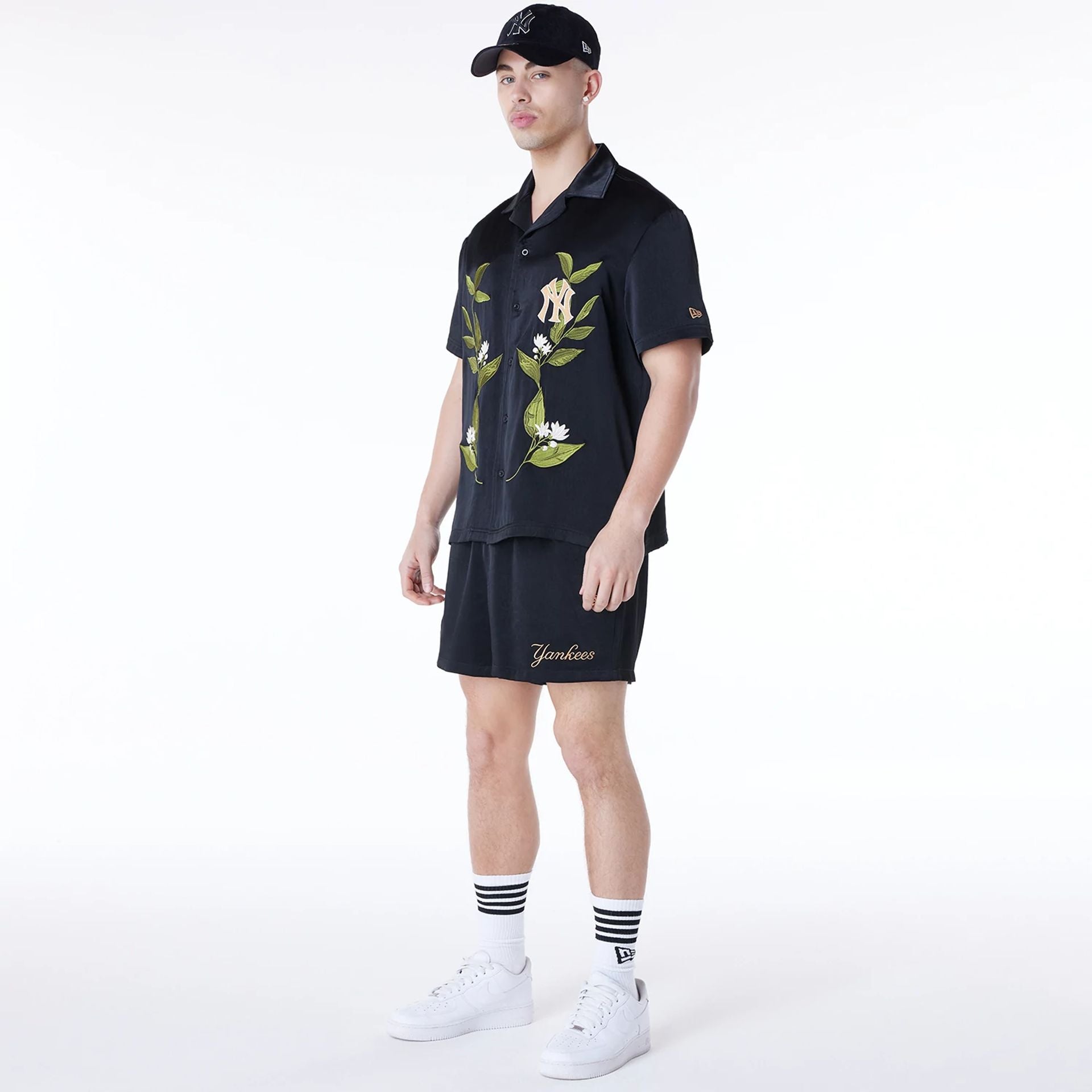 The Male model is wearing New York Yankees Floral Revere Black Short Sleeve Shirt 3