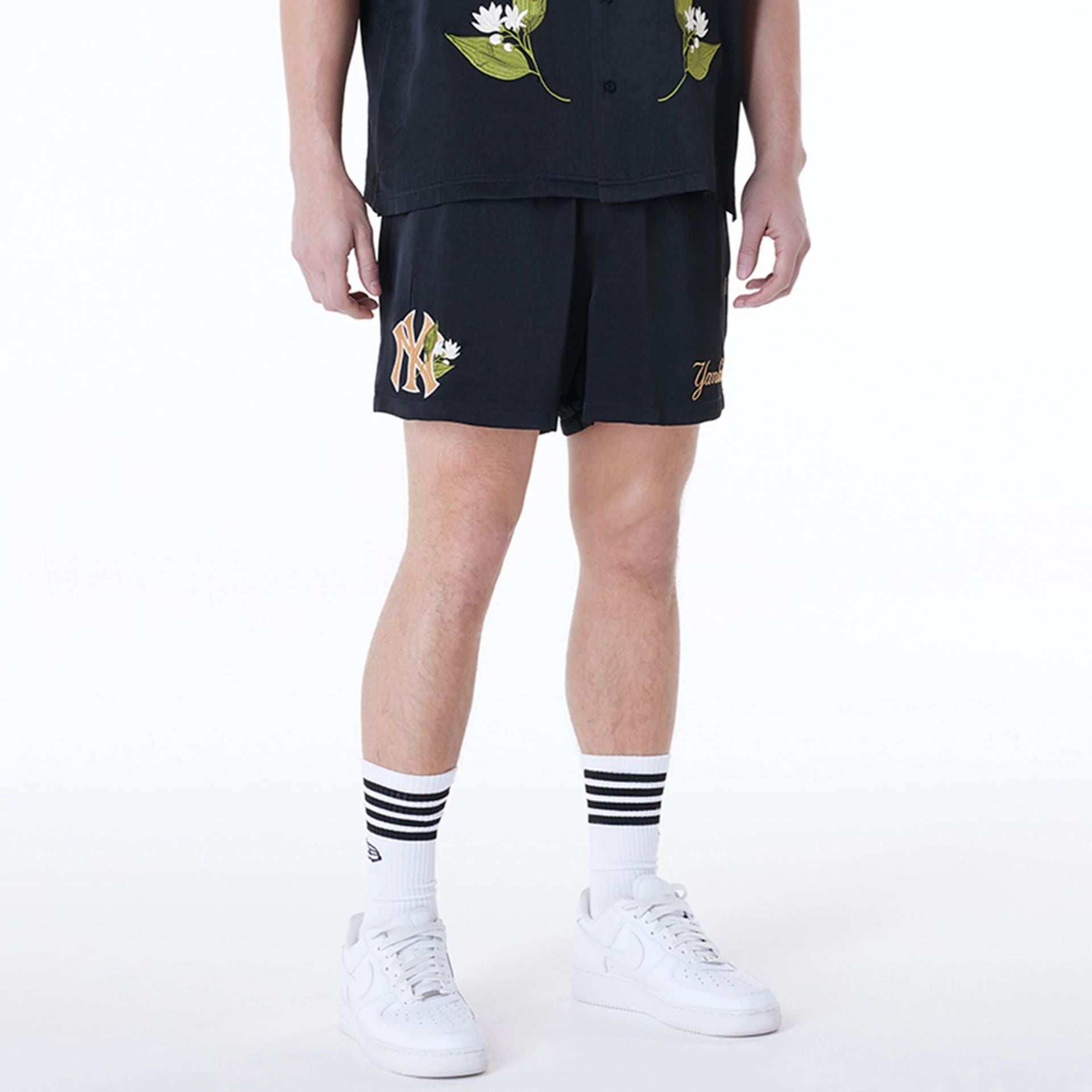 The Male model is wearing New York Yankees MLB Woven Black Shorts 1