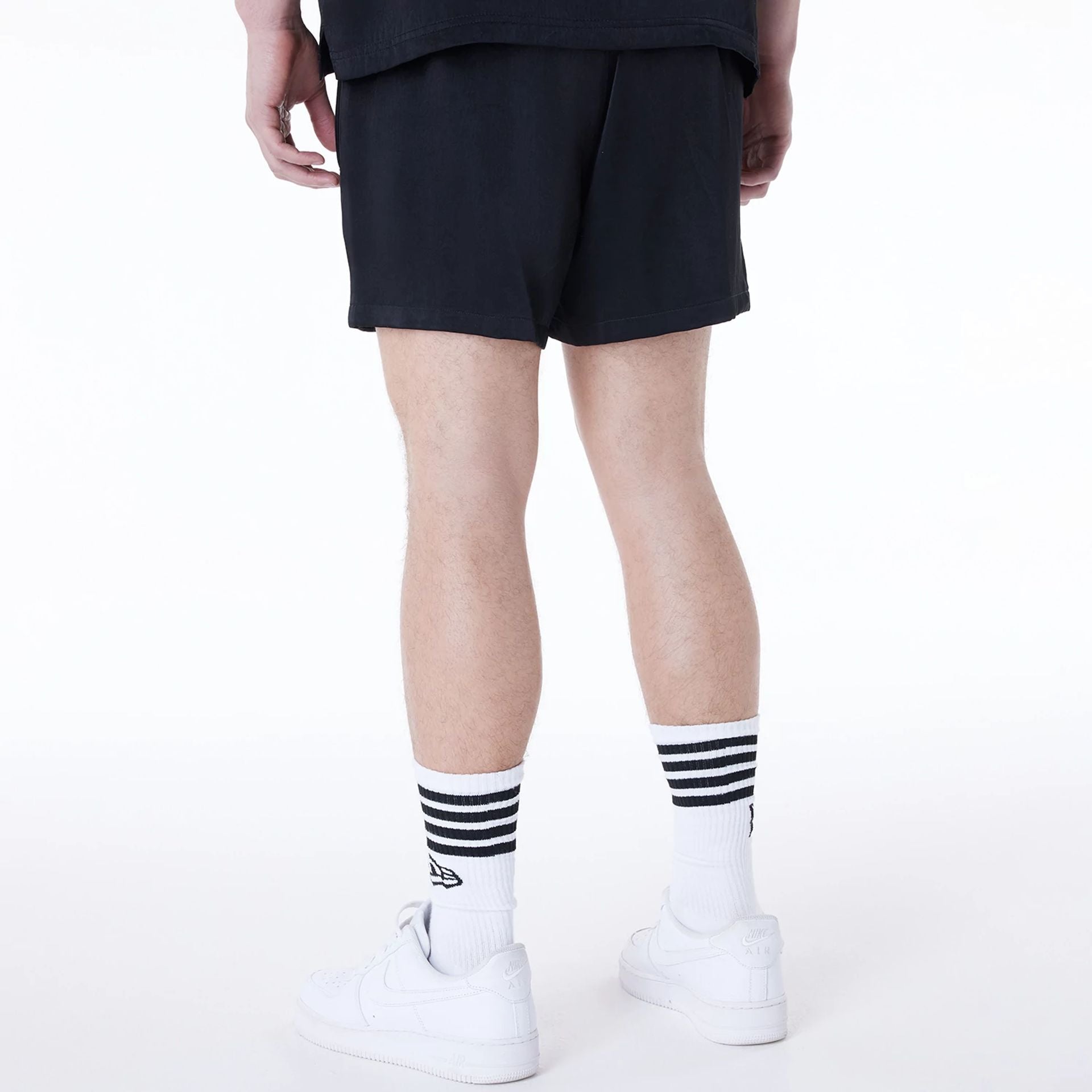 The Male model is wearing New York Yankees MLB Woven Black Shorts 6