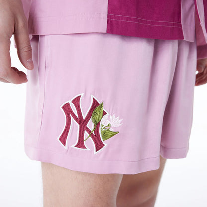 The Male model is wearing New York Yankees MLB Woven Dark Pink Shorts 3