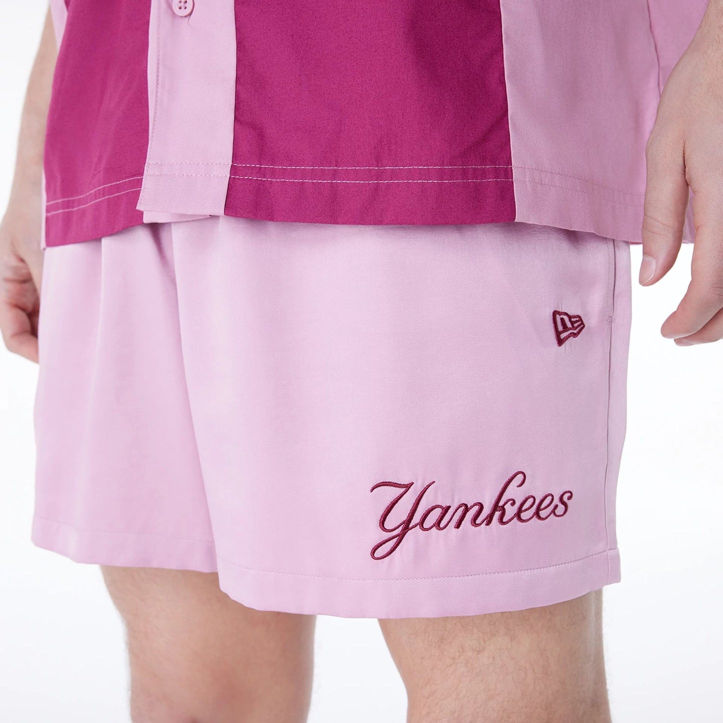 The Male model is wearing New York Yankees MLB Woven Dark Pink Shorts 6