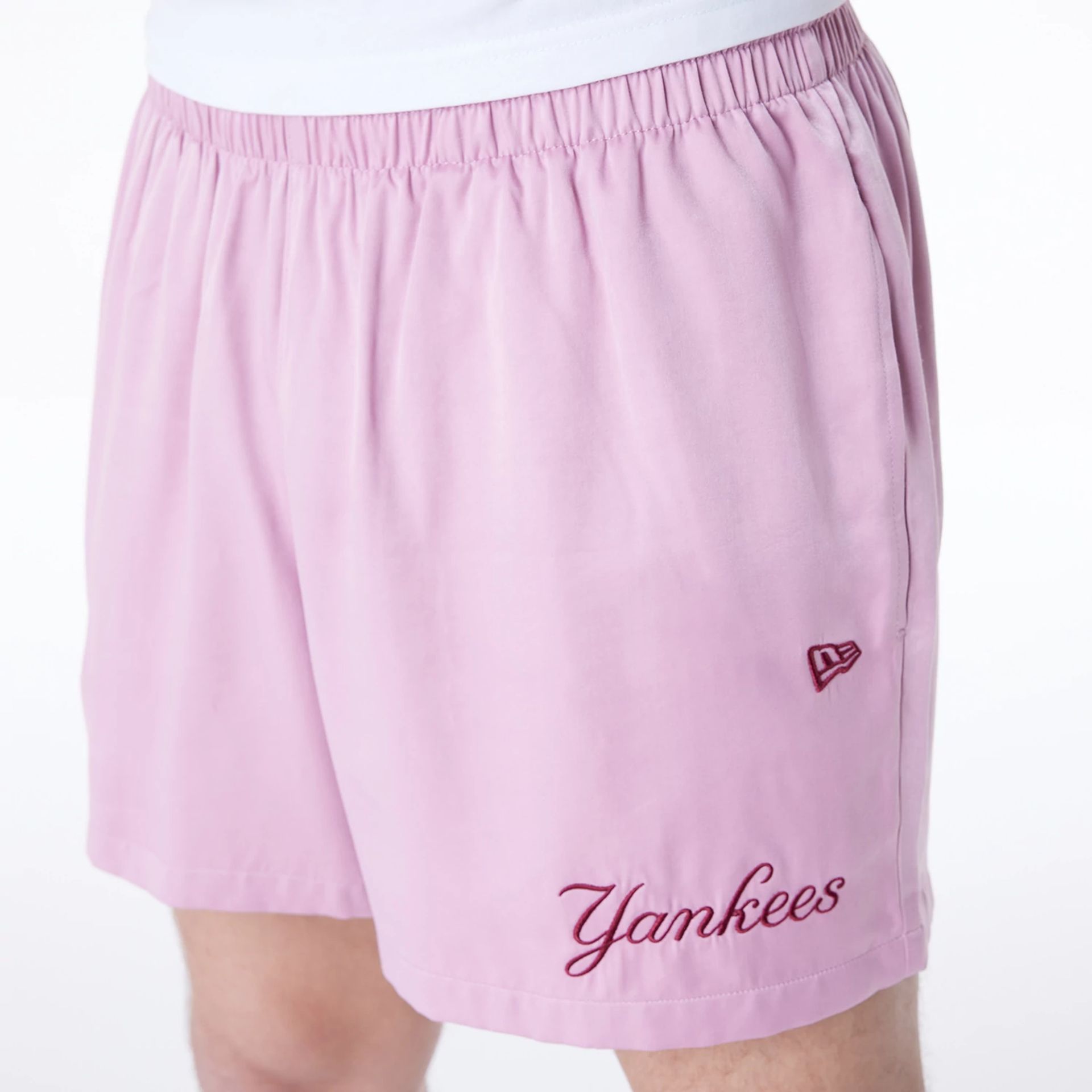 The Male model is wearing New York Yankees MLB Woven Dark Pink Shorts 8