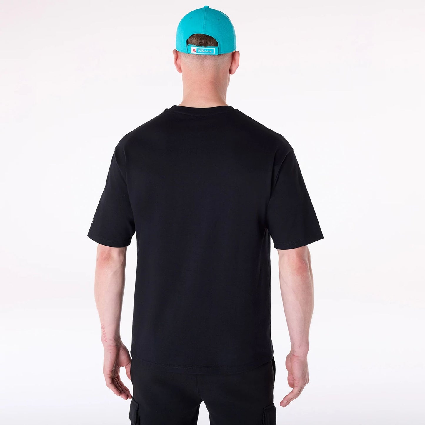 The Male model is wearing Miami Dolphins NFL Helmet Black T-Shirt 2