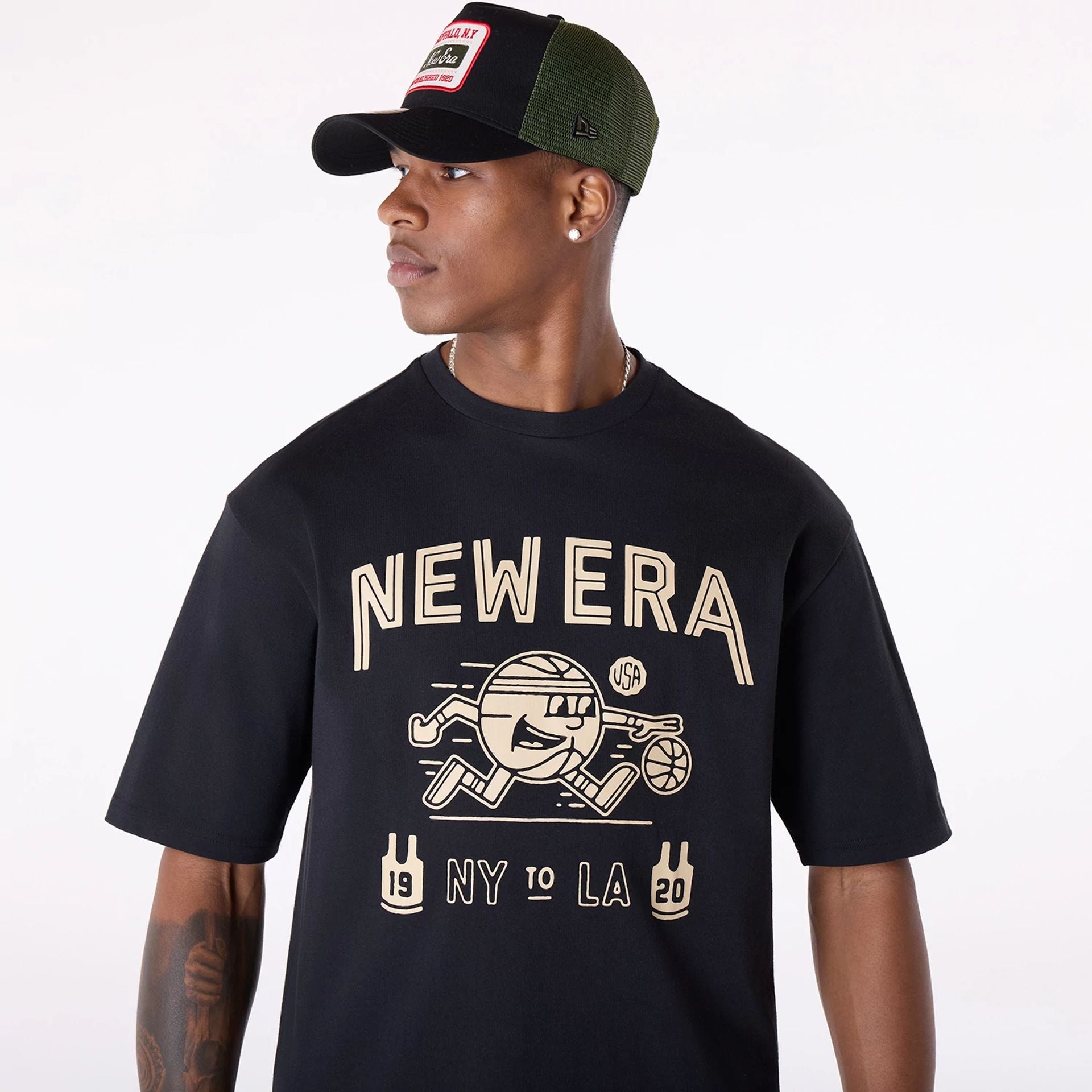 The Male model is wearing New Era Basketball Graphic Black T-Shirt 7